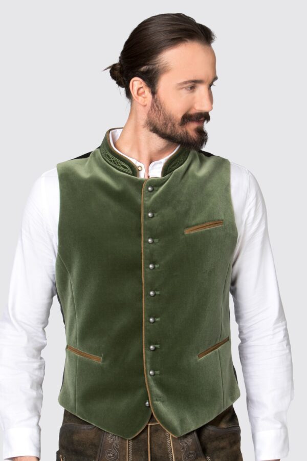 Man wearing olive green authentic lederhosen vest, zoomed