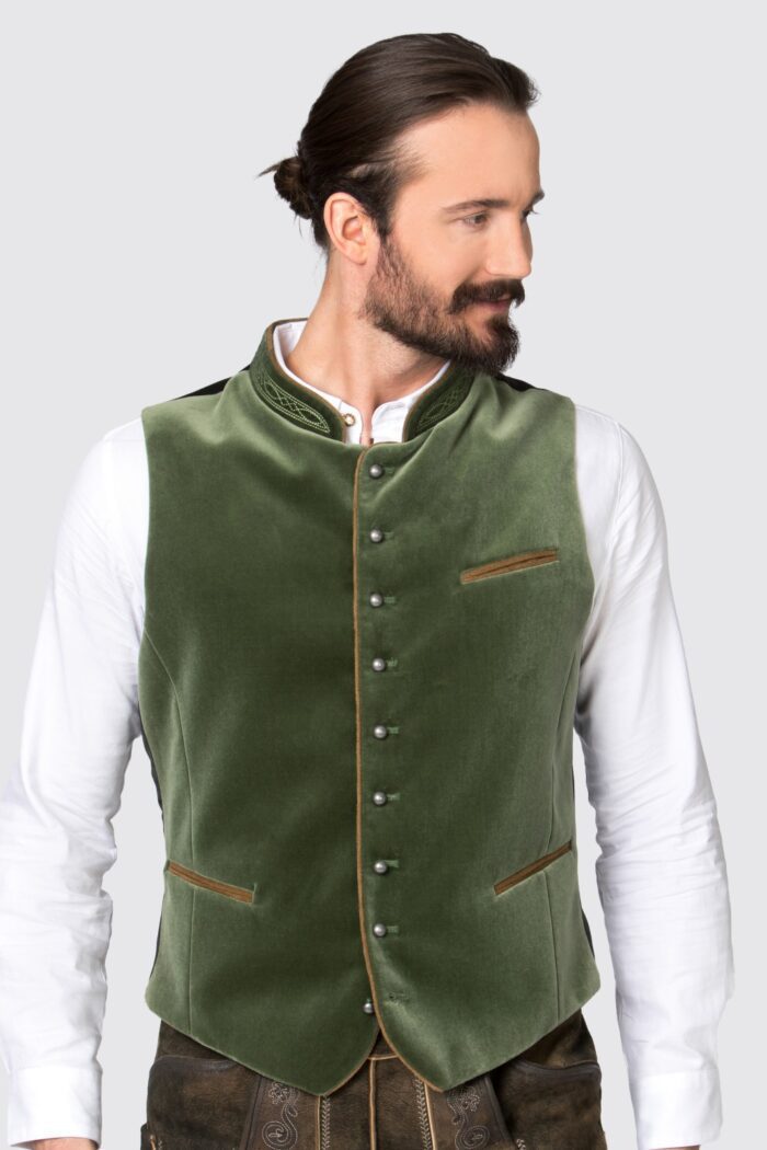 Man wearing olive green authentic lederhosen vest, zoomed