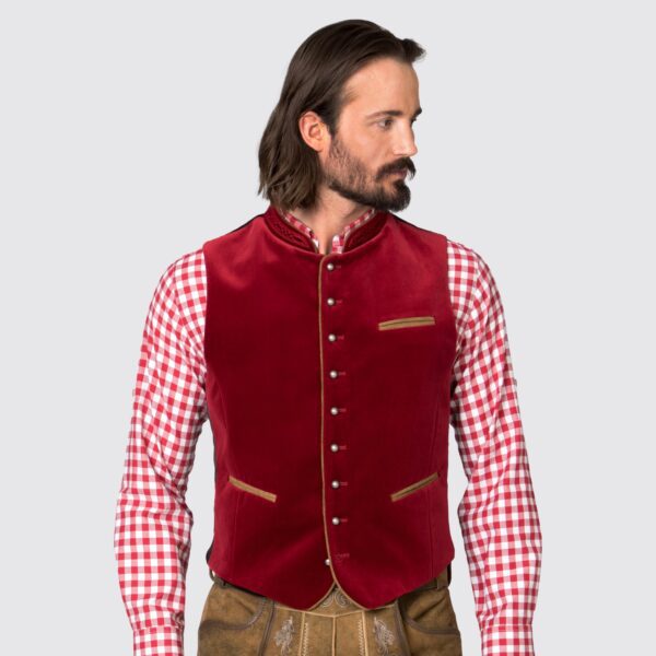 Man wearing traditional German vest in deep red, zoomed