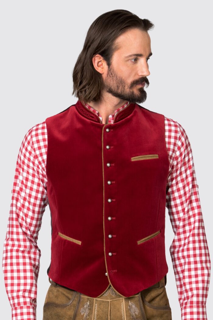Man wearing traditional German vest in deep red, zoomed