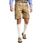 Front View of man wearing of handcrafted German lederhosen in mountain beige