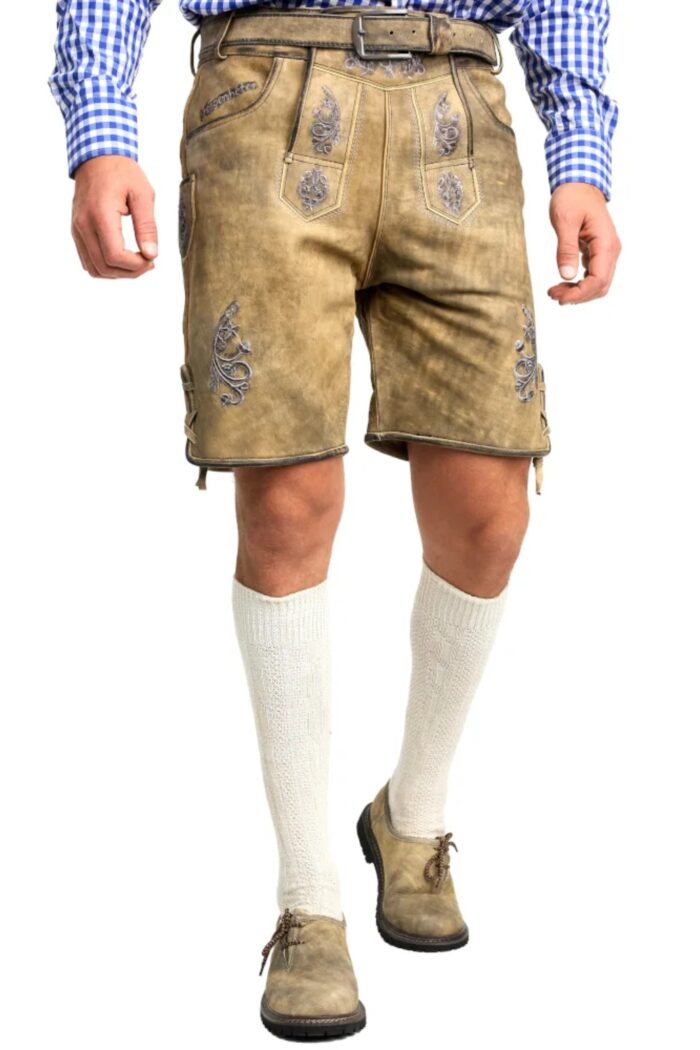 Front View of man wearing of handcrafted German lederhosen in mountain beige