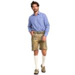 Man wearing handcrafted German lederhosen in mountain beige