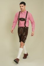 Model walking in Tyrolean Dark Oak Classic Lederhosen with suspenders