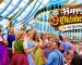 Happy Oktoberfest in German sign inside a festive beer tent
