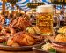 Traditional Oktoberfest food including roast chicken, pork knuckle, pretzels and sausages